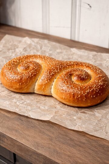 St. Joesophs bread on parchment on wood countertop